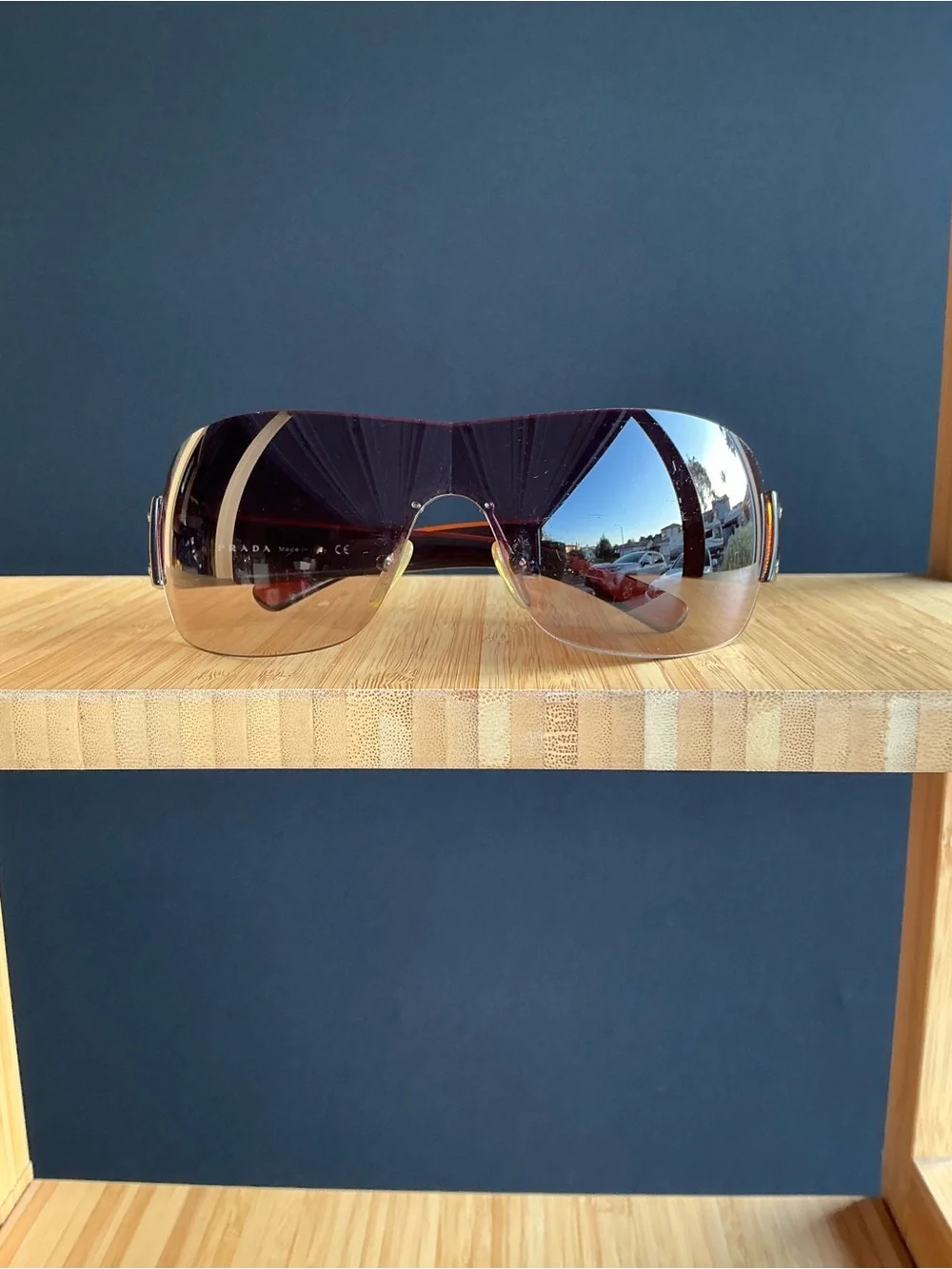 Prada  wrap-around shield sunglasses brown sunglasses with red accents